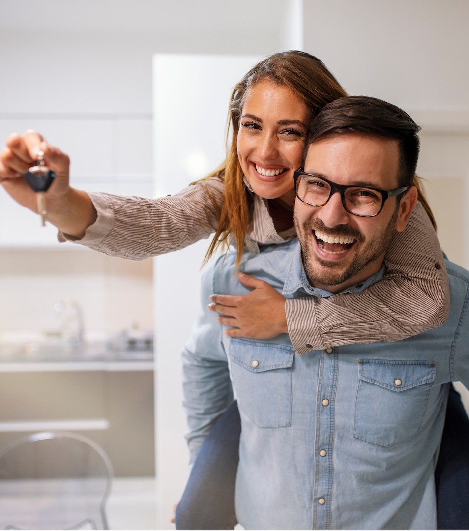 happy couple after buying first home